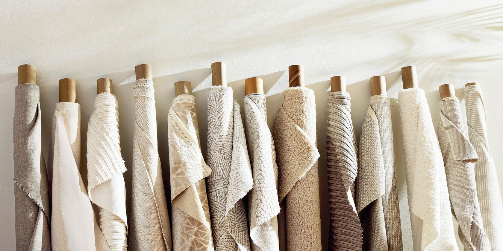 Assort of rolls of fabric colors and textures