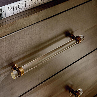 Acrylic handle on wooden dresser